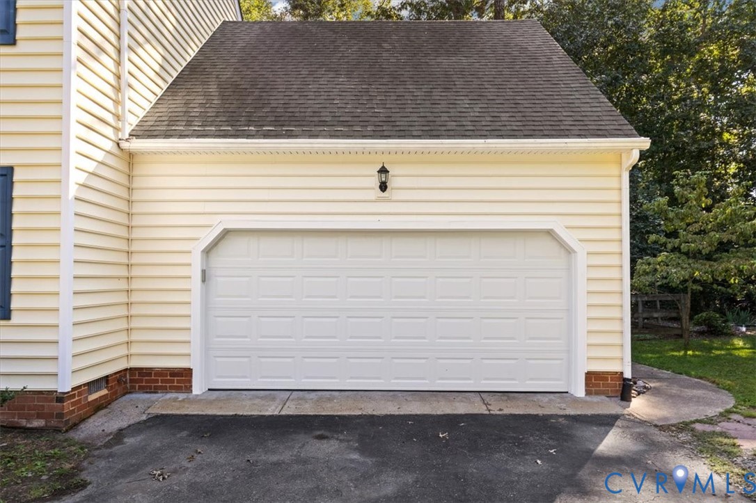 13905 Shadow Ridge Lane Midlothian, VA 23112 - Photo 50 of 55 Attached garage with a panel-style door, exterior