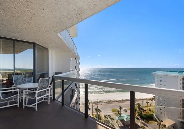 a view of furniture and floor to ceiling window