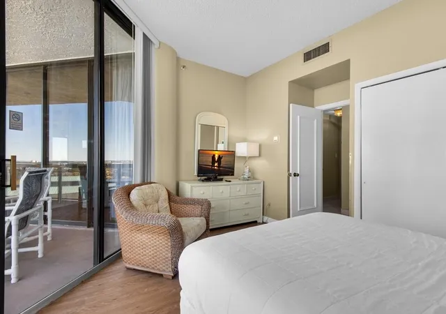 a bedroom with a bed and a couch