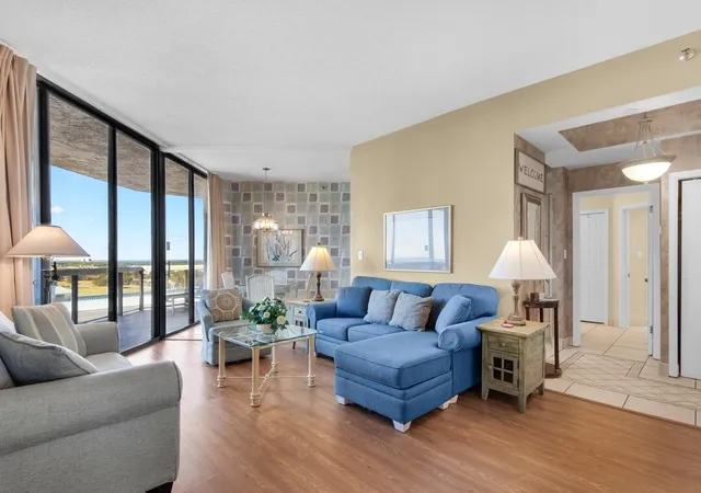 a living room with furniture and a large window