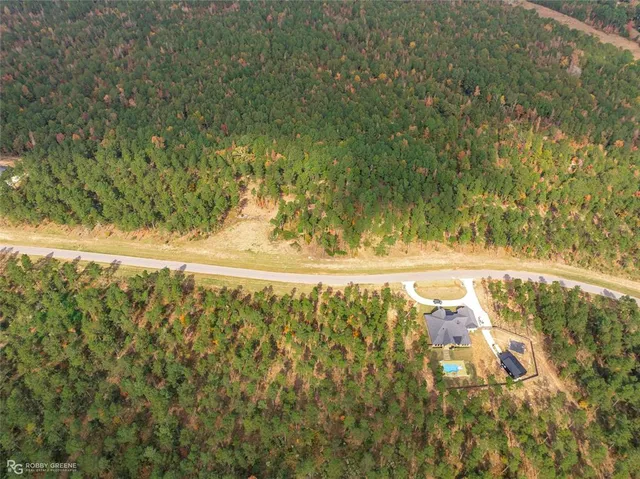 a view of a yard with an outdoor seating