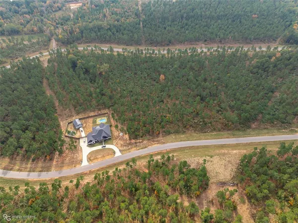 a view of a yard with a lake view