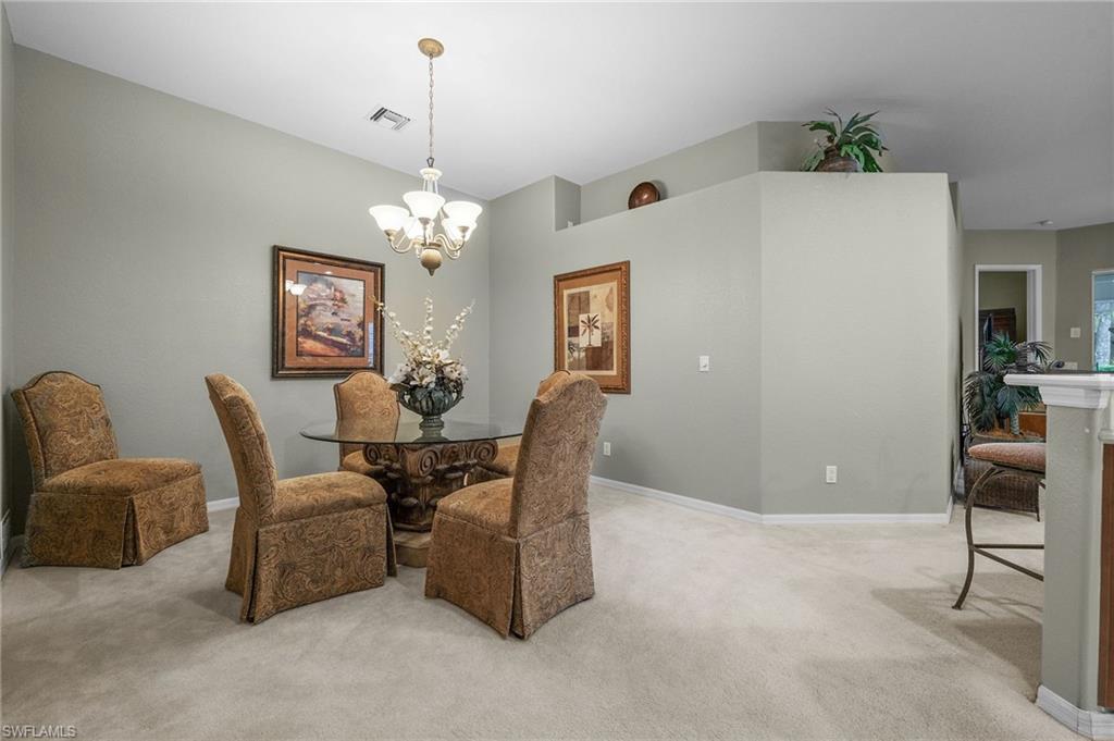 28531-f B F B Fowler Court Bonita Springs, FL 34135 - Photo 11 of 34 a dining room with furniture and window