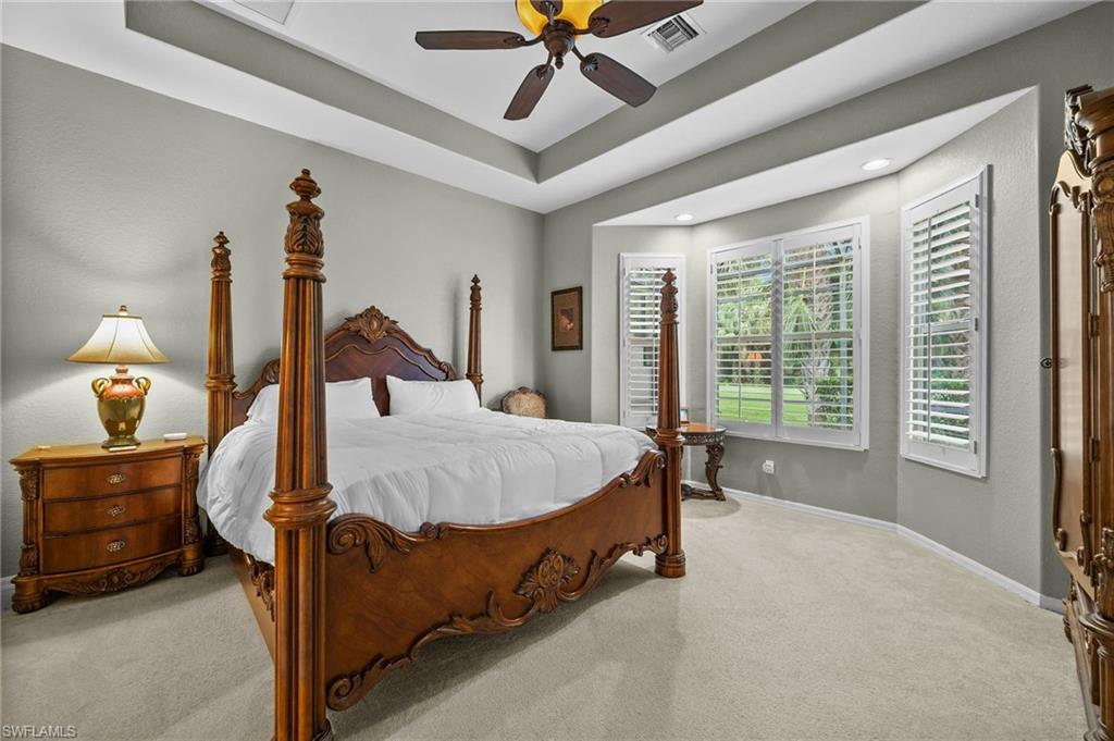 28531-f B F B Fowler Court Bonita Springs, FL 34135 - Photo 13 of 34 a bed sitting in a bedroom next to a window