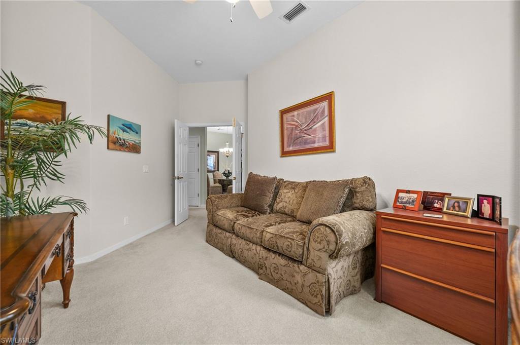 28531-f B F B Fowler Court Bonita Springs, FL 34135 - Photo 19 of 34 a living room with furniture and a potted plant