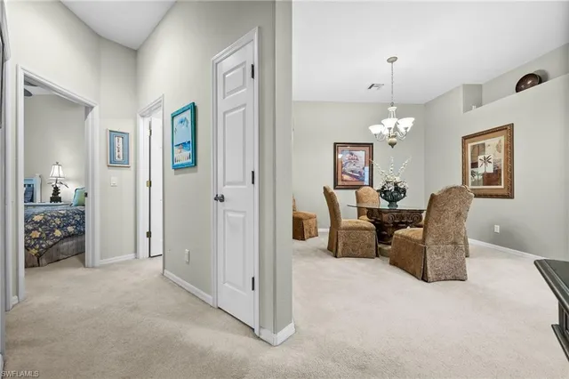 a view of a livingroom with furniture and a chandelier