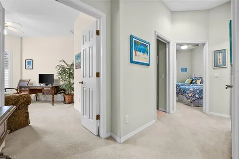 a view of a livingroom with workspace and a couch