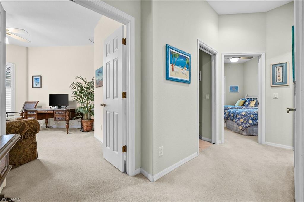 28531-f B F B Fowler Court Bonita Springs, FL 34135 - Photo 25 of 34 a view of a livingroom with workspace and a couch