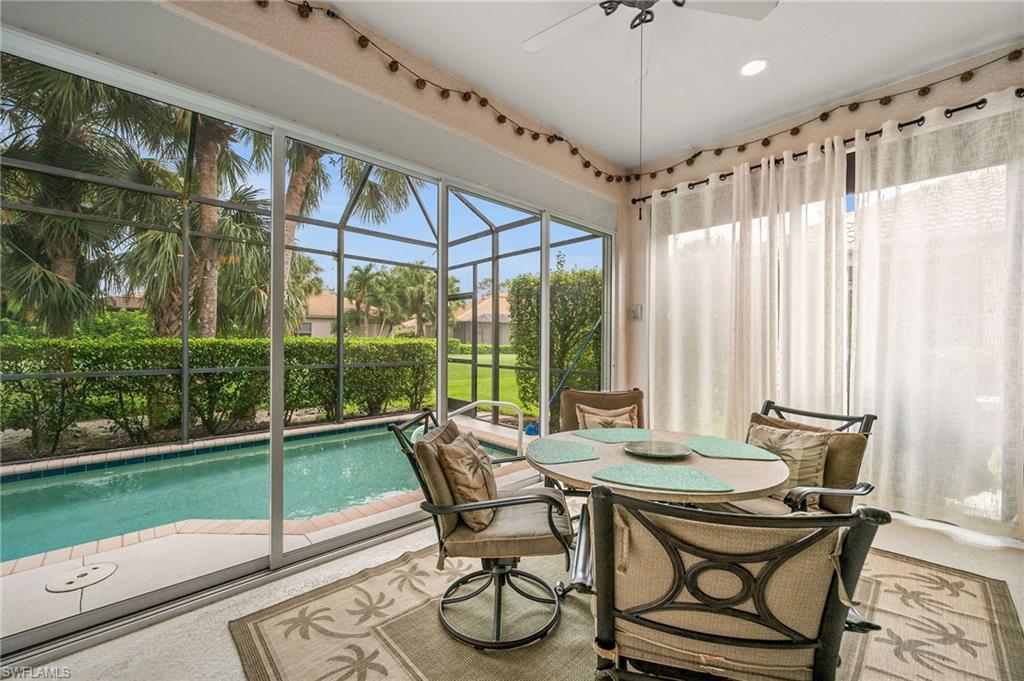 28531-f B F B Fowler Court Bonita Springs, FL 34135 - Photo 26 of 34 a view of a dining room with furniture wooden floor and chandelier