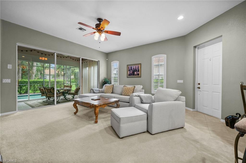 28531-f B F B Fowler Court Bonita Springs, FL 34135 - Photo 4 of 34 a living room with furniture and a large window