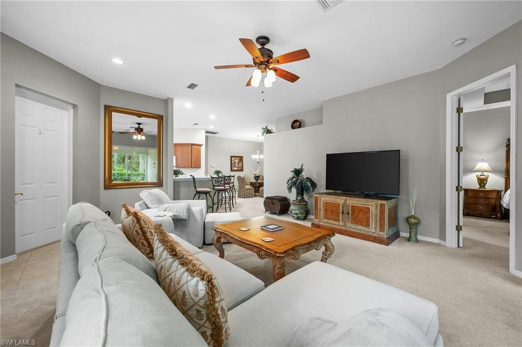 28531-f B F B Fowler Court Bonita Springs, FL 34135 - Photo 6 of 34 a living room with furniture and a flat screen tv