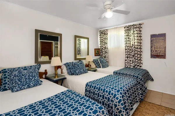 a bedroom with bed and a window