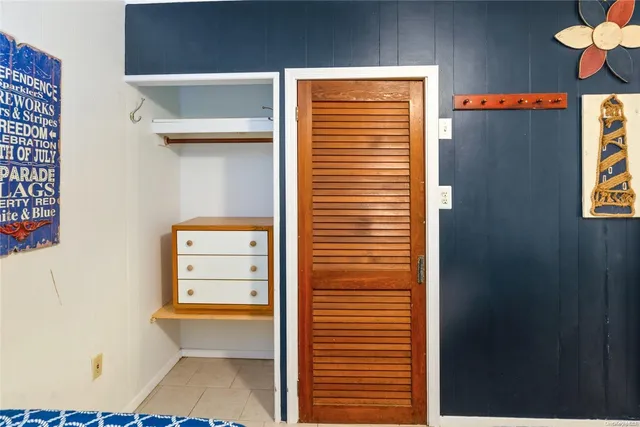 a view of walk in closet with window