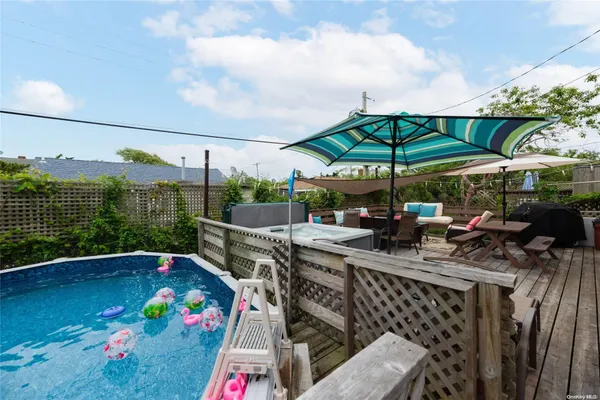 a view of outdoor space with seating area and barbeque oven