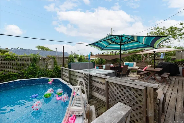 a view of outdoor space with seating area and barbeque oven