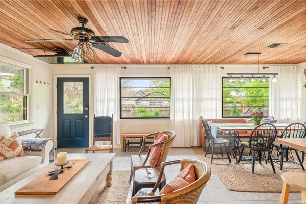 a view of a dining room with furniture window and outside view