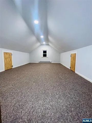 an empty room with a empty space and windows