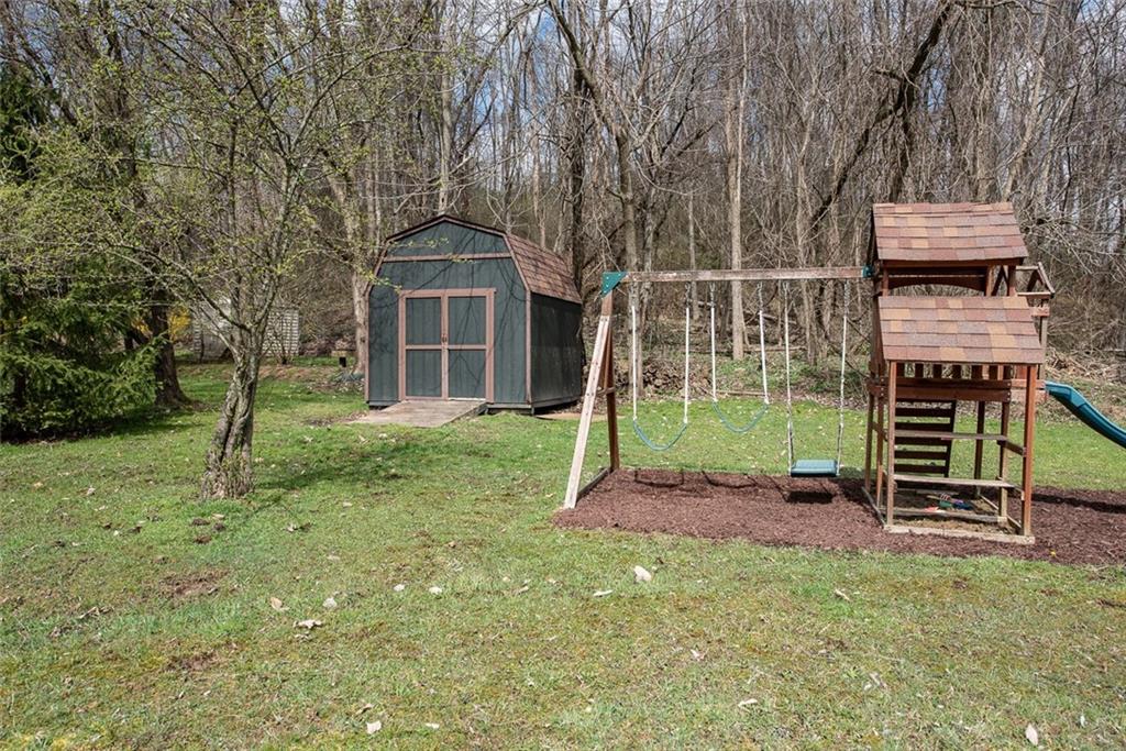1657 O'Block Road Pittsburgh, PA 15239 - Photo 23 of 24 Large, level backyard with swing set and shed.