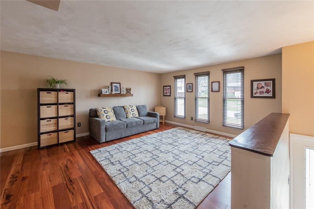 1657 O'Block Road Pittsburgh, PA 15239 - Photo 10 of 24 The living room with great natural light from the floor-to-ceiling windows.