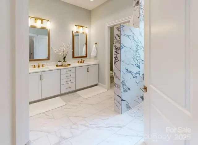 a spacious bathroom with a mirror a sink and a bathtub
