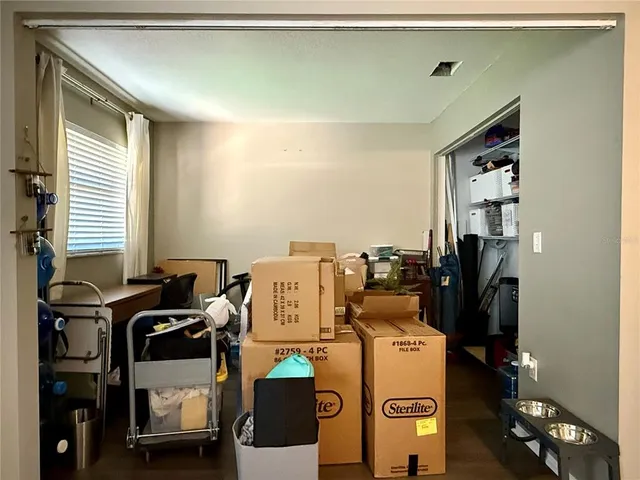 a view of storage and utility room with washer and dryer