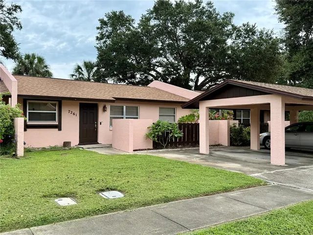 a front view of a house with a yard and porch
