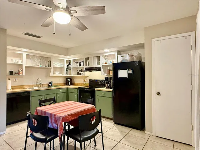 a kitchen with a refrigerator a sink dishwasher and a stove
