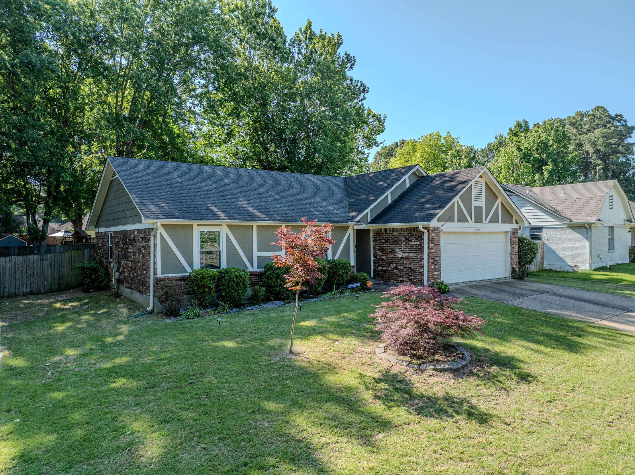 3276 Altruria Road Bartlett, TN 38134 - Photo 1 of 30 Traditional-style residence featuring a dark shingle roof, brick and siding exterior, and an attached two-car garage