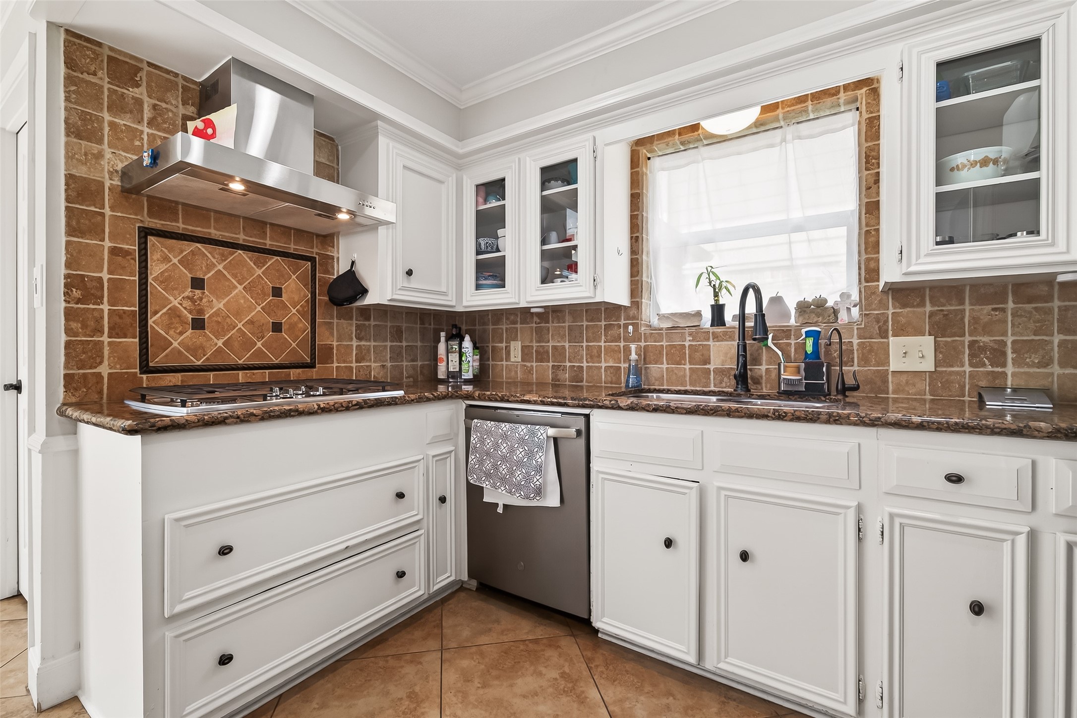 15843 Foxgate Road Houston, TX 77079 - Photo 20 of 49 a kitchen with stainless steel appliances cabinets and window
