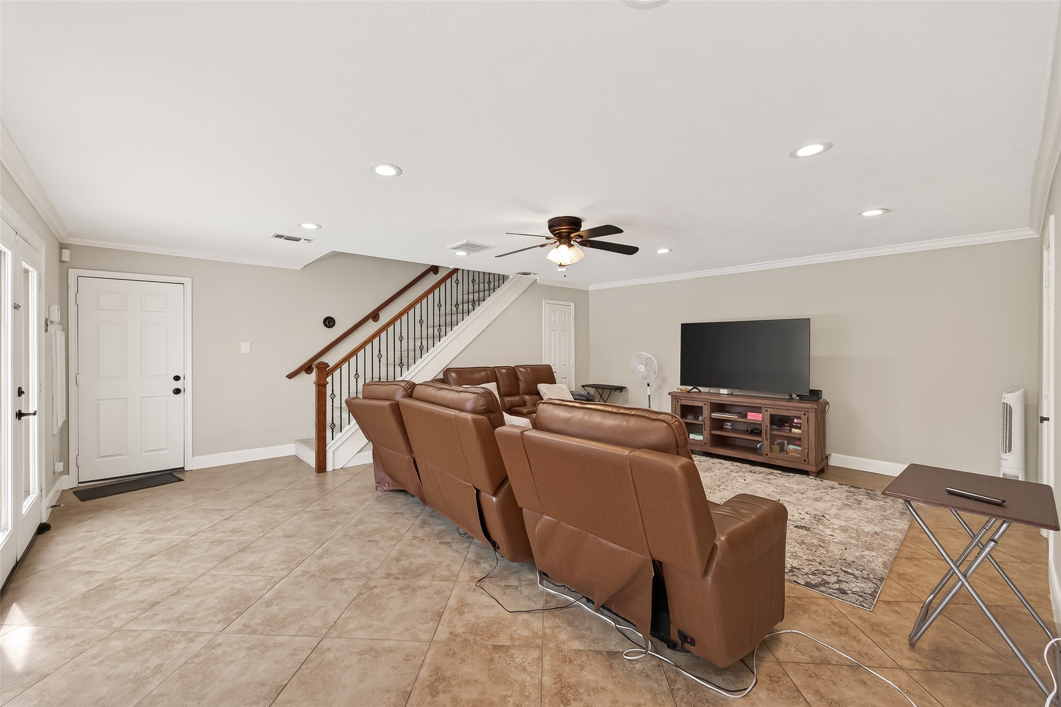 15843 Foxgate Road Houston, TX 77079 - Photo 23 of 49 a living room with furniture and a flat screen tv