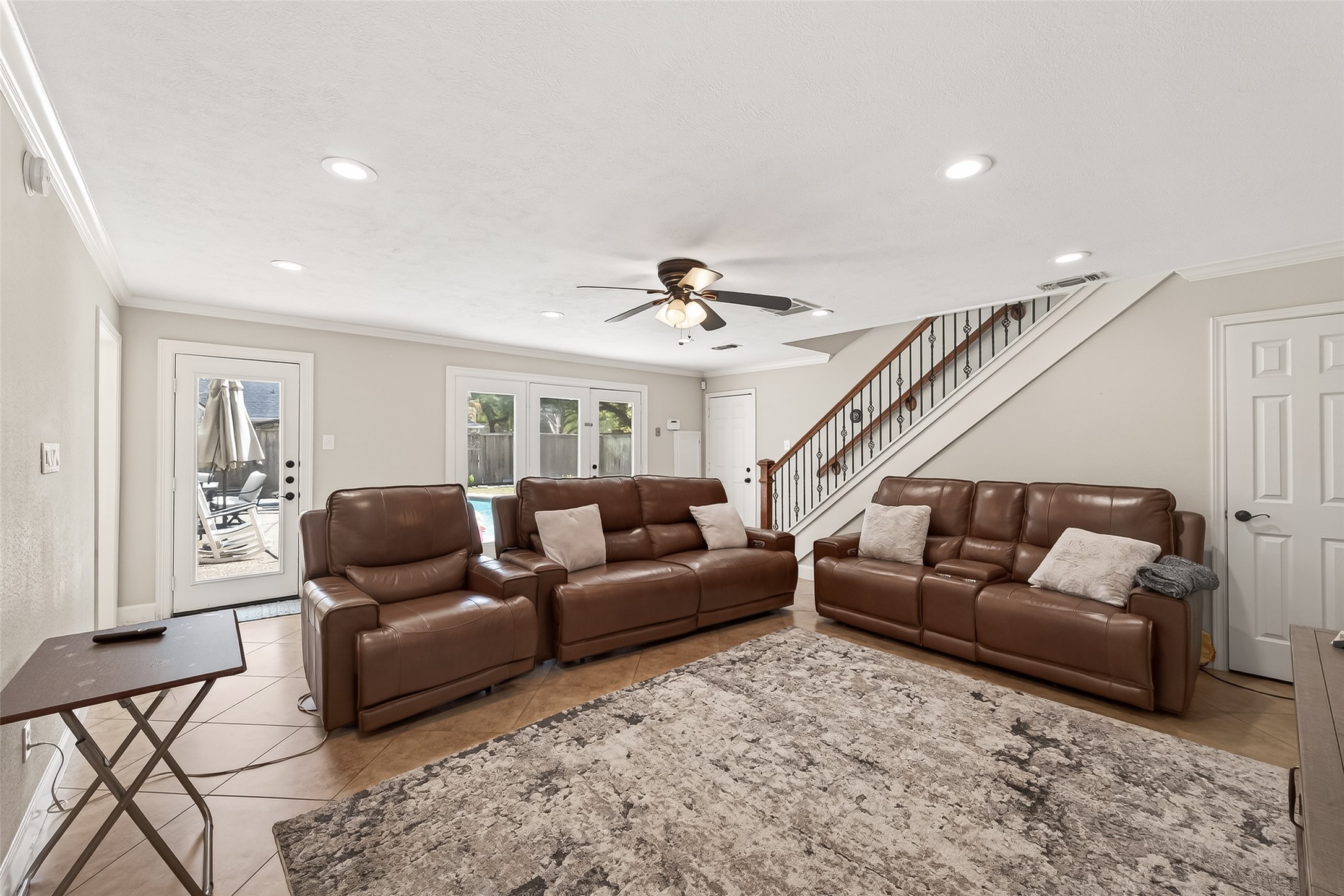 15843 Foxgate Road Houston, TX 77079 - Photo 25 of 49 a living room with furniture and a ceiling fan