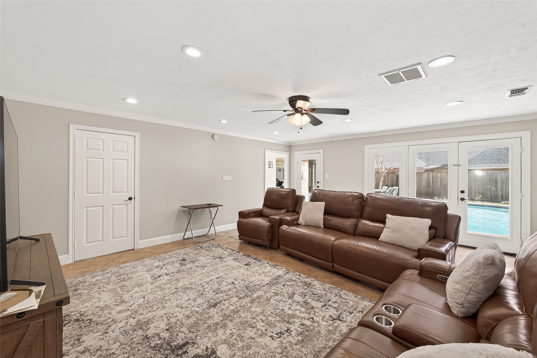 15843 Foxgate Road Houston, TX 77079 - Photo 26 of 49 a living room with furniture and a ceiling fan