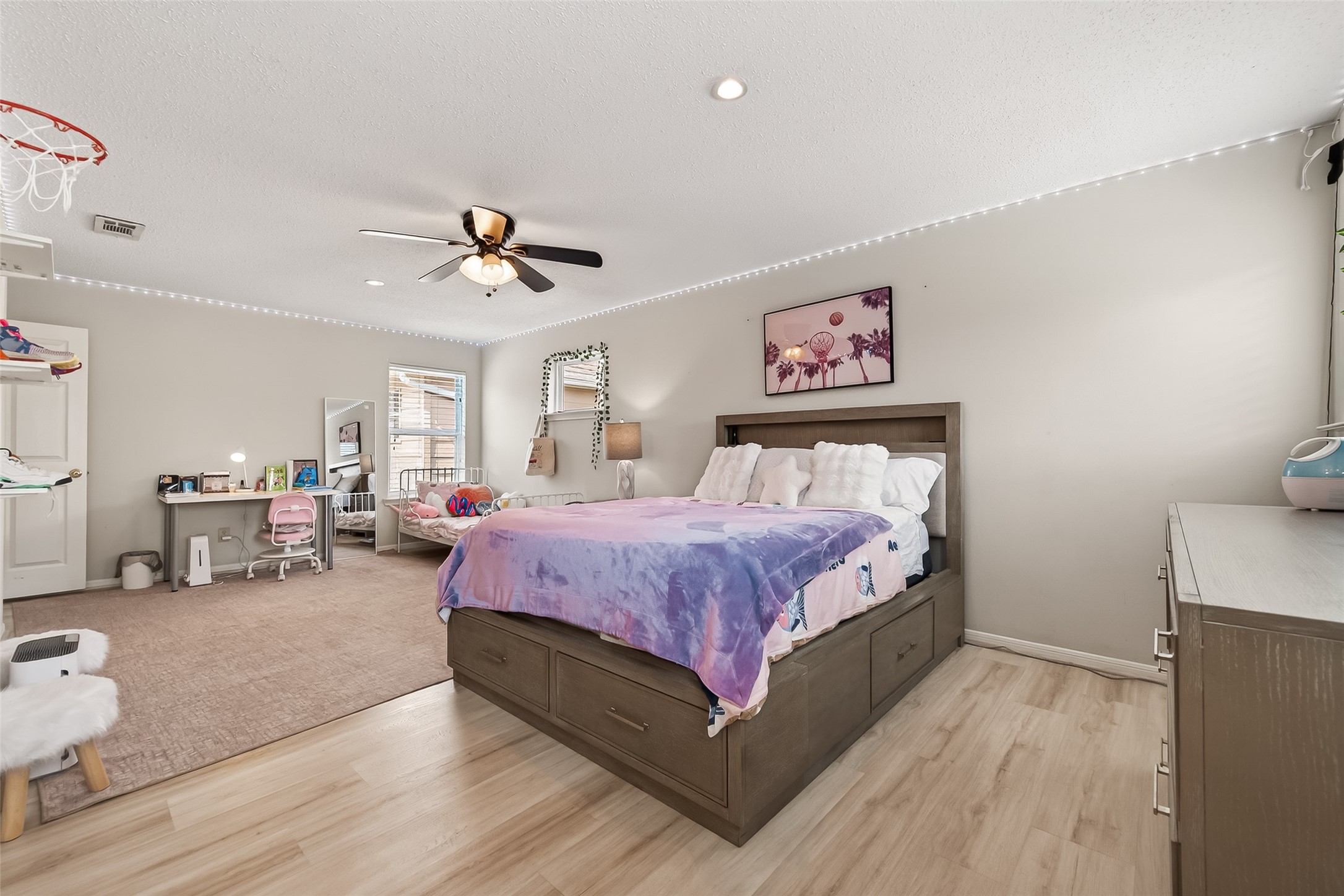 15843 Foxgate Road Houston, TX 77079 - Photo 30 of 49 a spacious bedroom with a bed and a chandelier