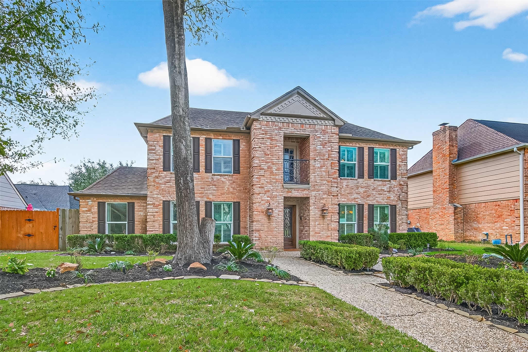15843 Foxgate Road Houston, TX 77079 - Photo 3 of 49 a front view of a house with a yard