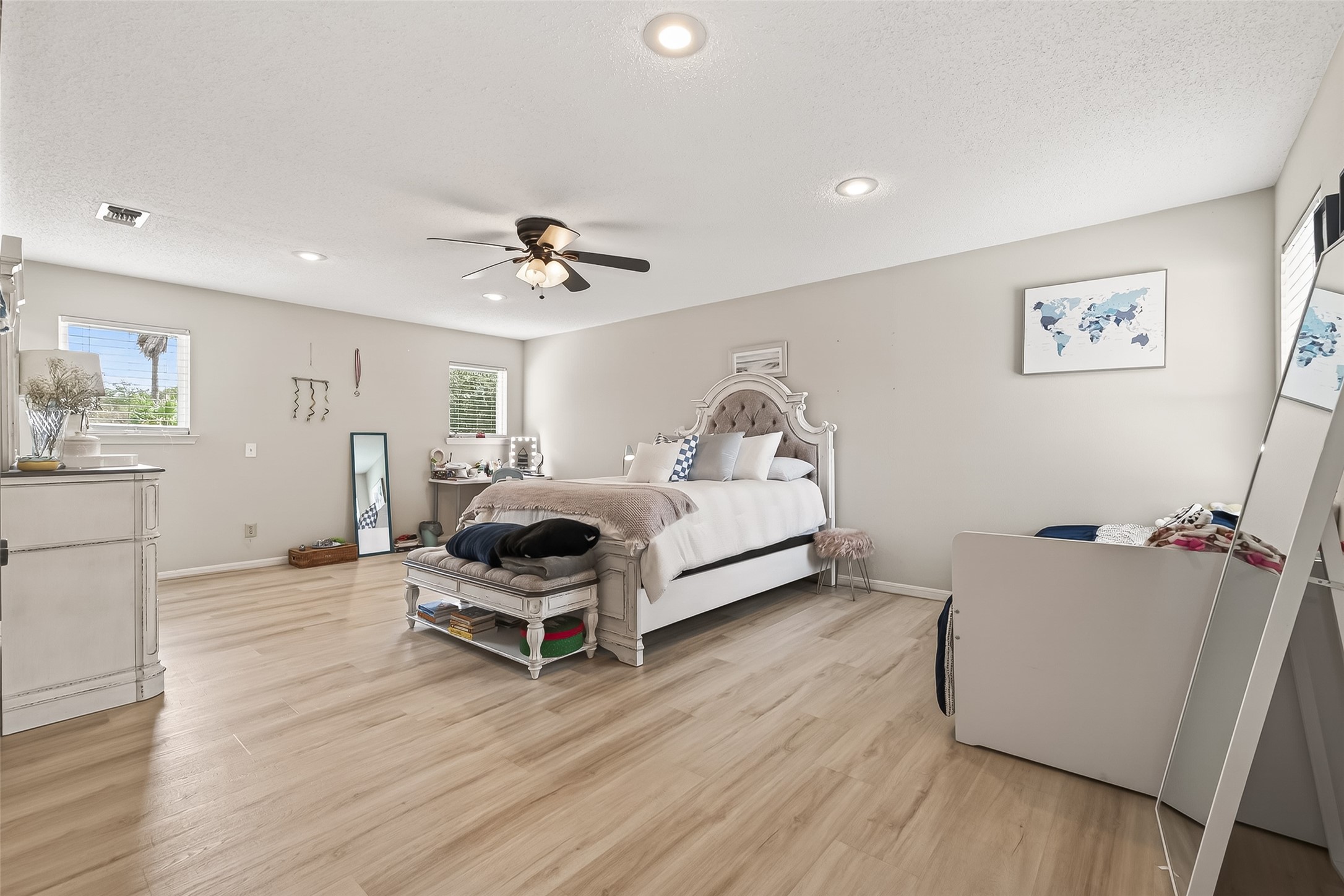 15843 Foxgate Road Houston, TX 77079 - Photo 32 of 49 a bedroom with a bed and a chandelier