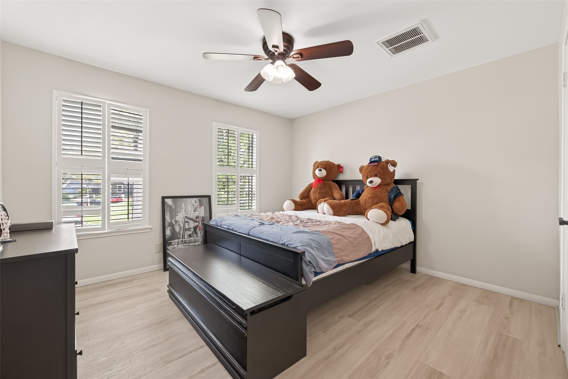 15843 Foxgate Road Houston, TX 77079 - Photo 38 of 49 a bed room with a bed and a window