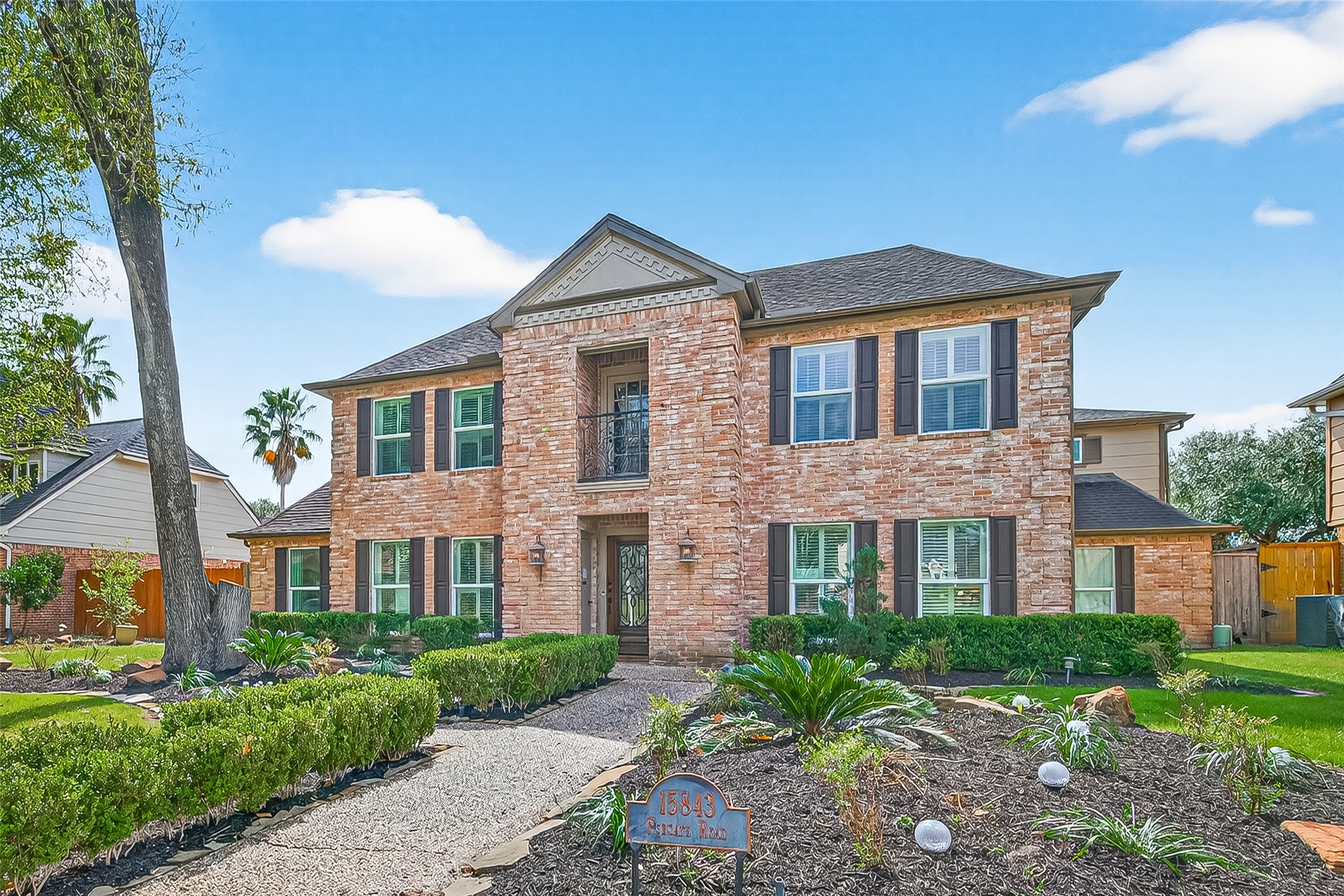 15843 Foxgate Road Houston, TX 77079 - Photo 4 of 49 a front view of a residential houses with yard and green space