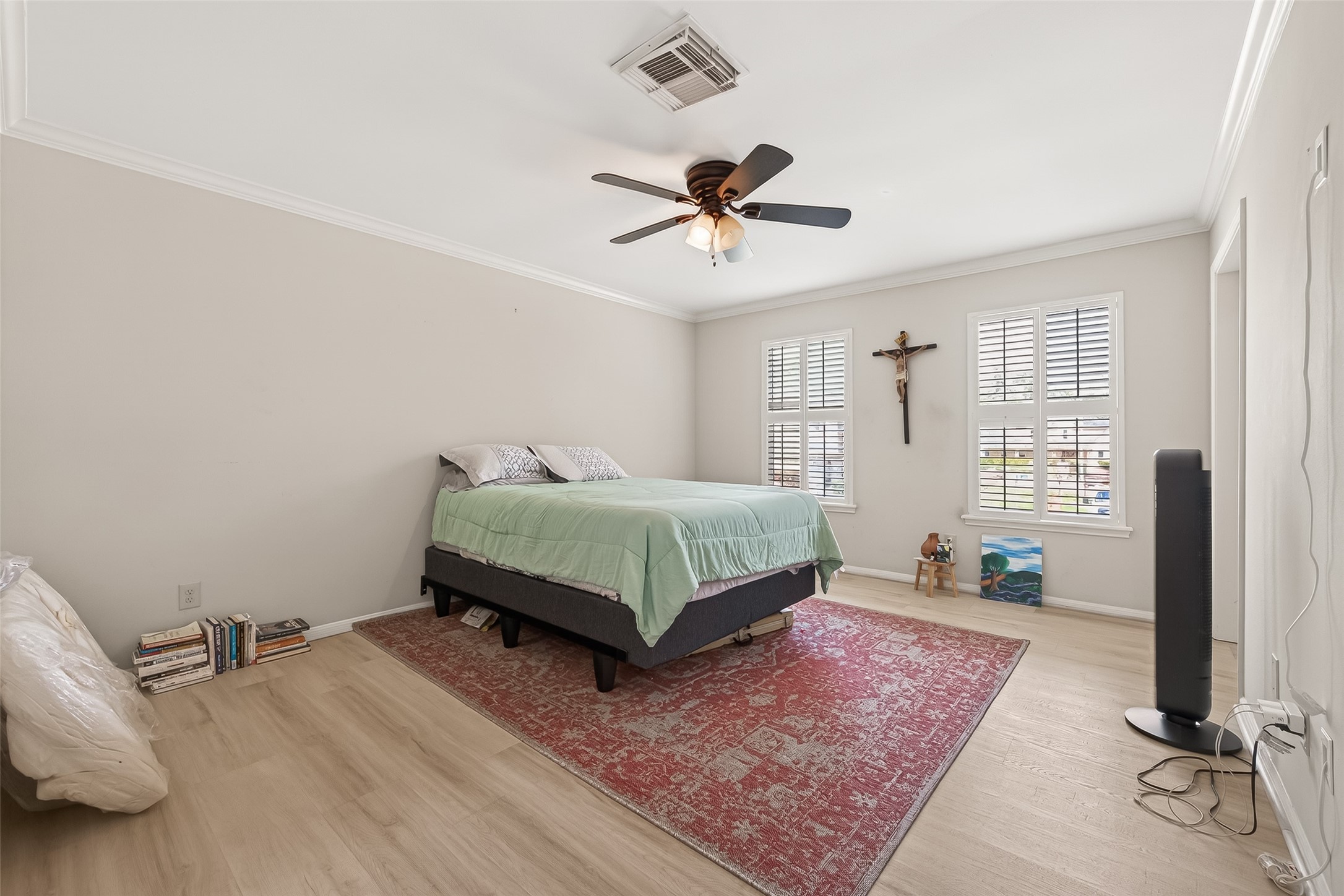 15843 Foxgate Road Houston, TX 77079 - Photo 41 of 49 a bedroom with a bed a mirror and desk