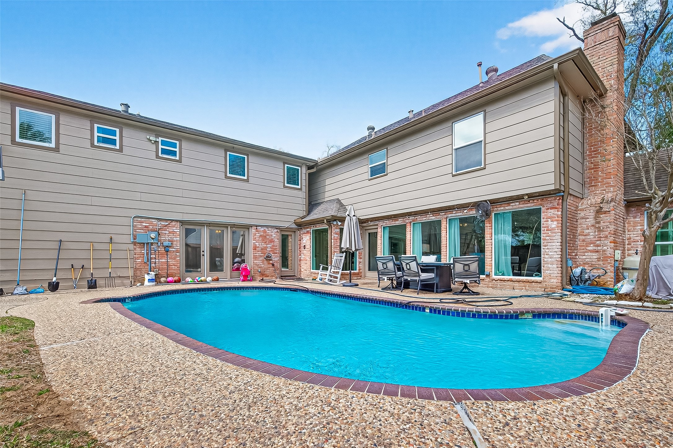 15843 Foxgate Road Houston, TX 77079 - Photo 47 of 49 a view of a house with swimming pool and sitting area