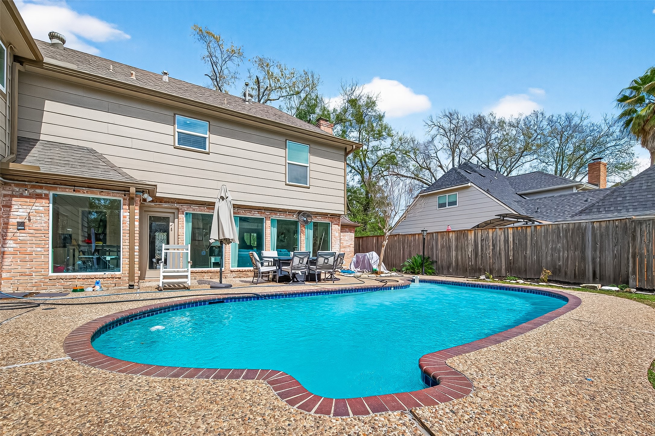 15843 Foxgate Road Houston, TX 77079 - Photo 48 of 49 a view of a house with backyard and sitting area