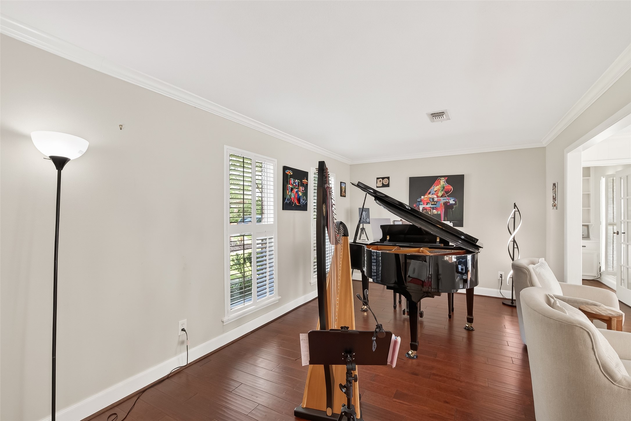 15843 Foxgate Road Houston, TX 77079 - Photo 6 of 49 a living room with wooden floor furniture and a potted plant