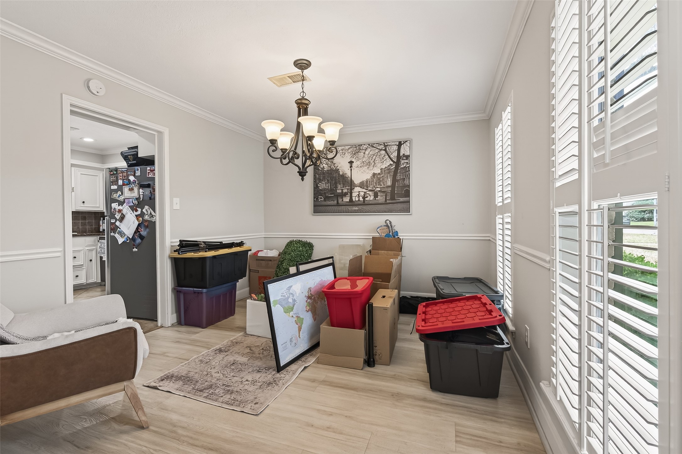 15843 Foxgate Road Houston, TX 77079 - Photo 8 of 49 a living room with furniture and a chandelier