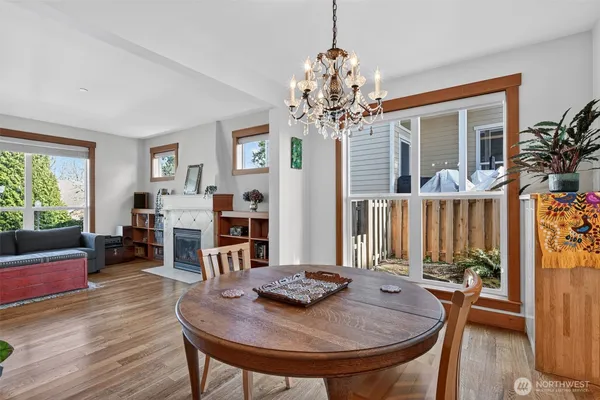 a view of a dining room with furniture window and wooden floor