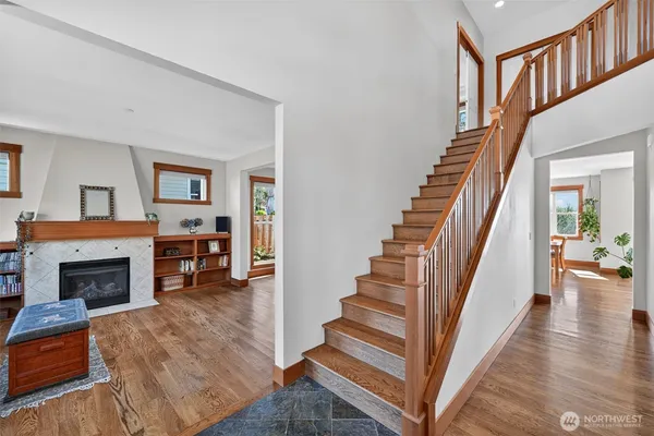 a view of entryway livingroom and hall with wooden floor