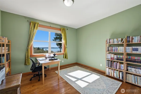 a workspace with furniture and a bookshelf