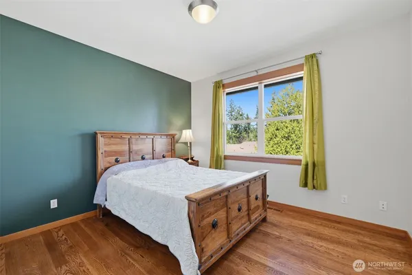 a bedroom with a bed and window