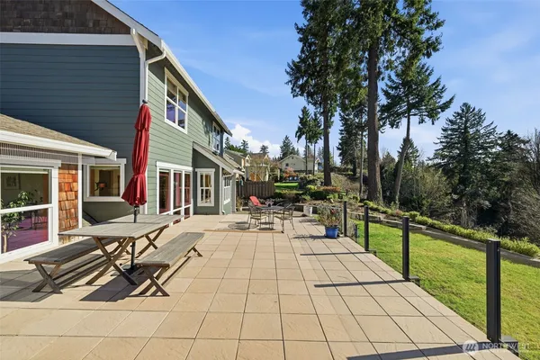 a view of a backyard with sitting area