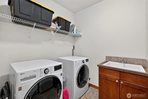 a utility room with dryer and washer