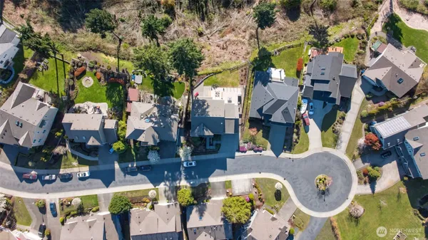an aerial view of houses with outdoor space