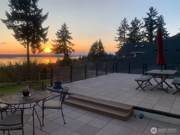 a view of a backyard with sitting area